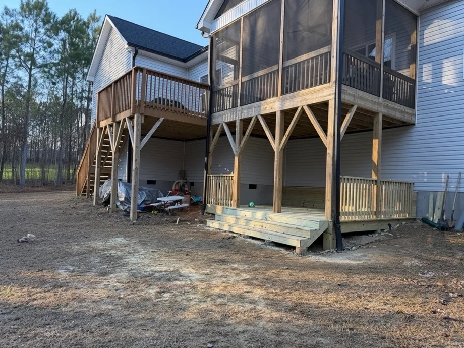 Two-story back deck with stairs and a screened porch