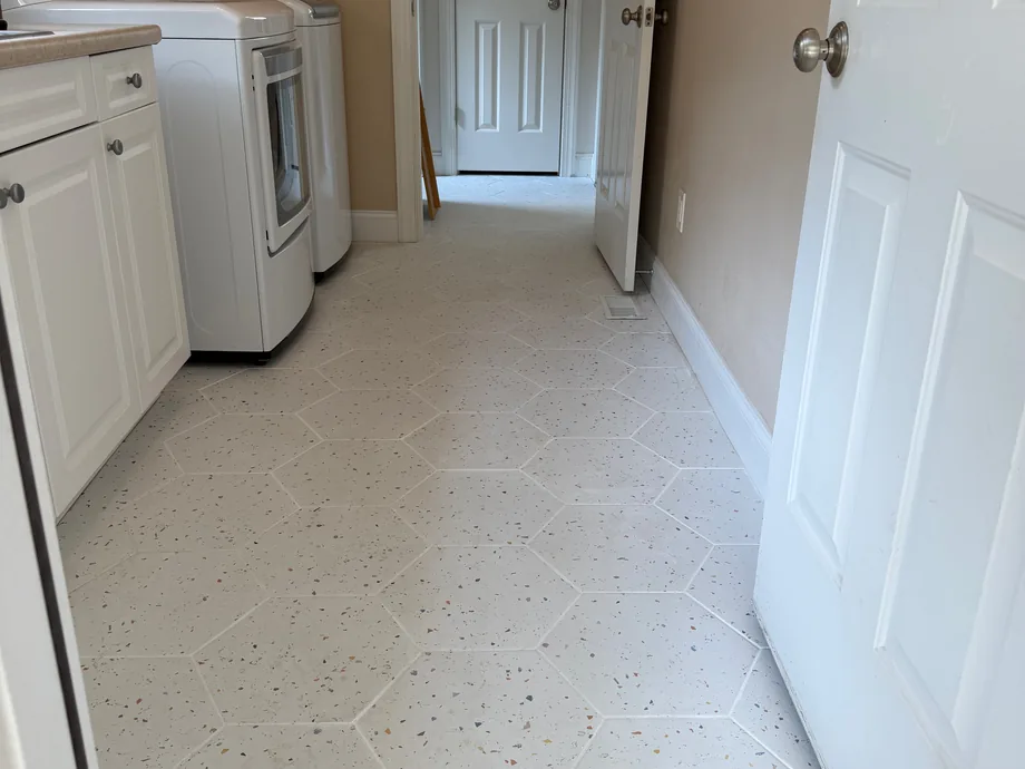 Hexagon floor tile installed in a laundry room